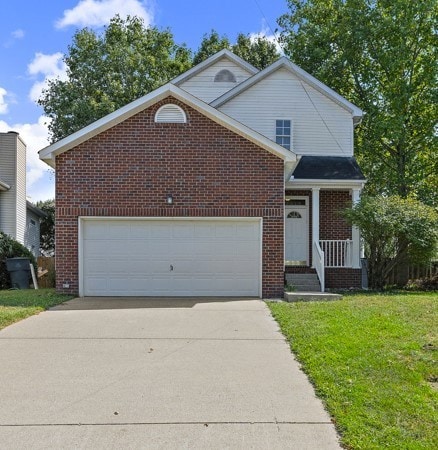 view of front property with a garage and a front yard