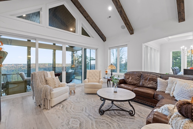 living room with high vaulted ceiling, light hardwood / wood-style flooring, a healthy amount of sunlight, and beam ceiling