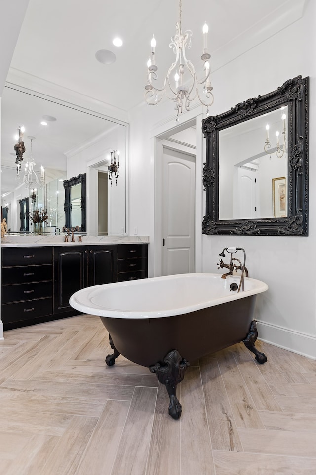 bathroom featuring vanity, a bathing tub, and ornamental molding