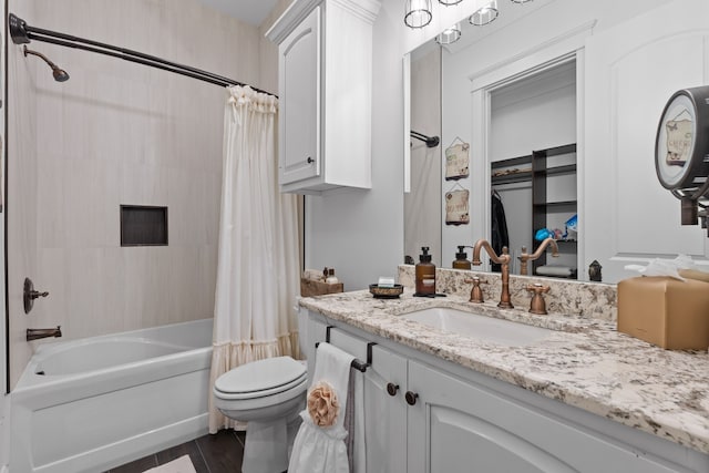 full bathroom featuring vanity, shower / bath combo, and toilet