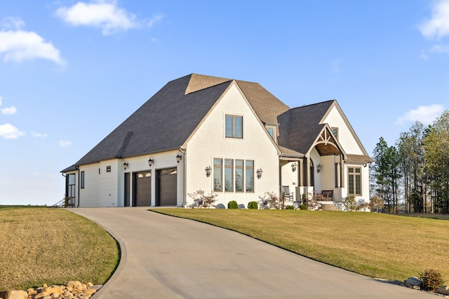 view of front facade with a garage and a front yard