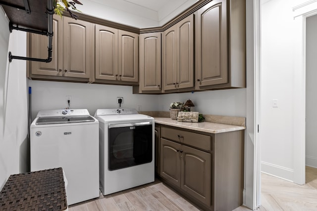 laundry area featuring cabinets and independent washer and dryer