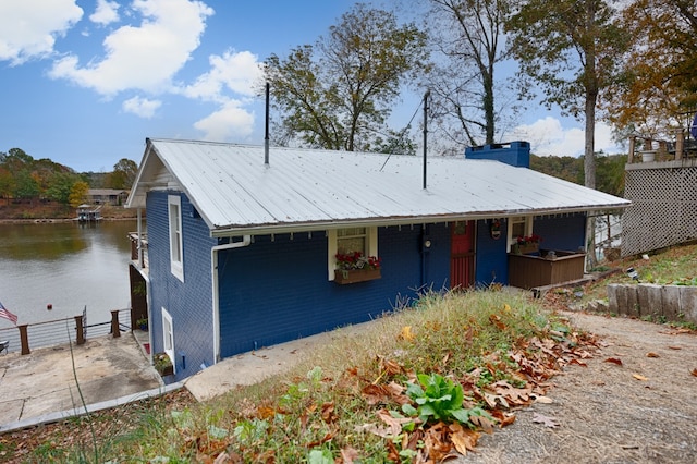 view of front of home featuring a water view