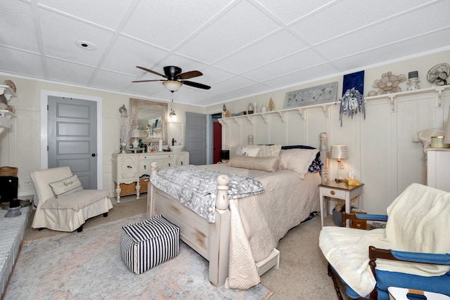 bedroom featuring ceiling fan and light carpet