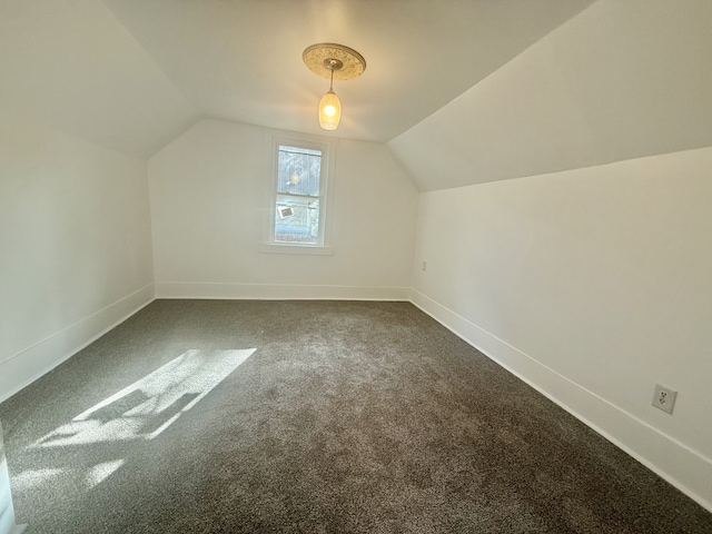 bonus room featuring carpet floors and vaulted ceiling