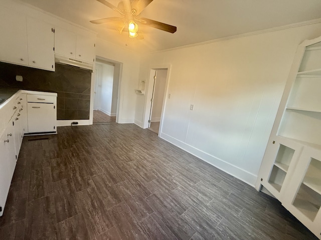 kitchen featuring white cabinetry, ornamental molding, dark wood-type flooring, and ceiling fan