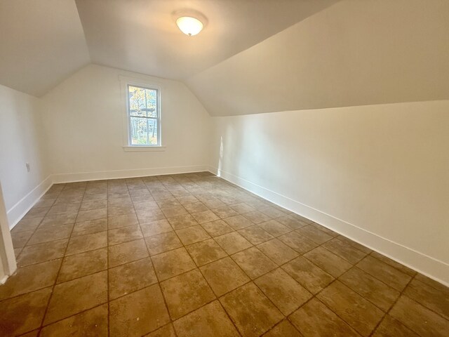 additional living space with lofted ceiling