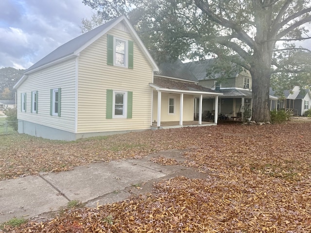 back of house with a patio area