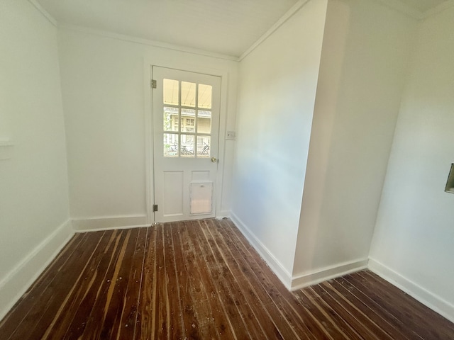 doorway with dark hardwood / wood-style floors and crown molding