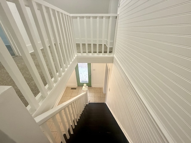 staircase with tile patterned floors