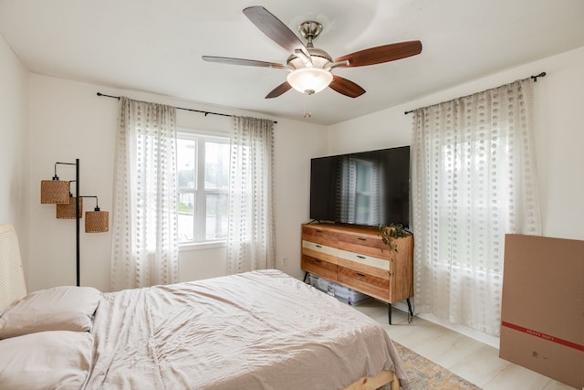 bedroom featuring ceiling fan and light wood-type flooring