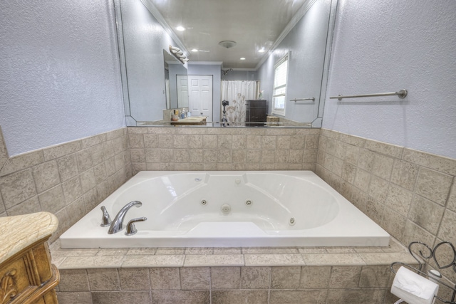 bathroom with vanity, tiled bath, and ornamental molding