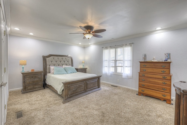 bedroom featuring ornamental molding, light carpet, and ceiling fan