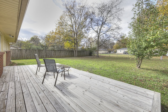 wooden deck with a yard