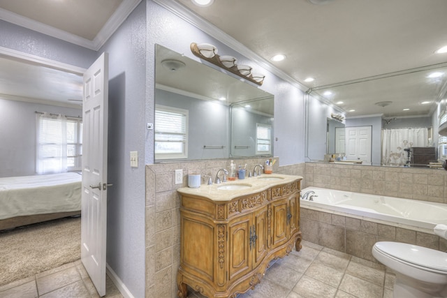 bathroom with vanity, toilet, tiled tub, and ornamental molding