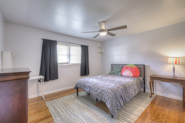 bedroom featuring hardwood / wood-style floors and ceiling fan