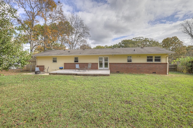 back of house with a lawn