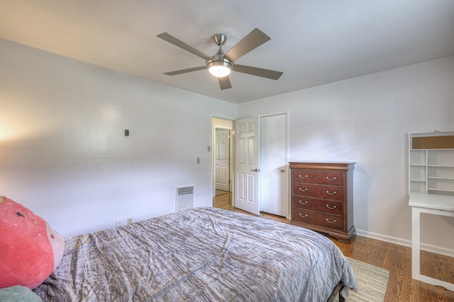 bedroom featuring wood-type flooring and ceiling fan