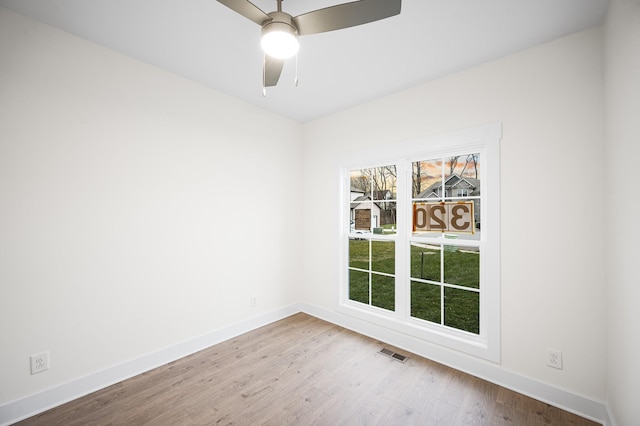 unfurnished room featuring ceiling fan and light hardwood / wood-style floors