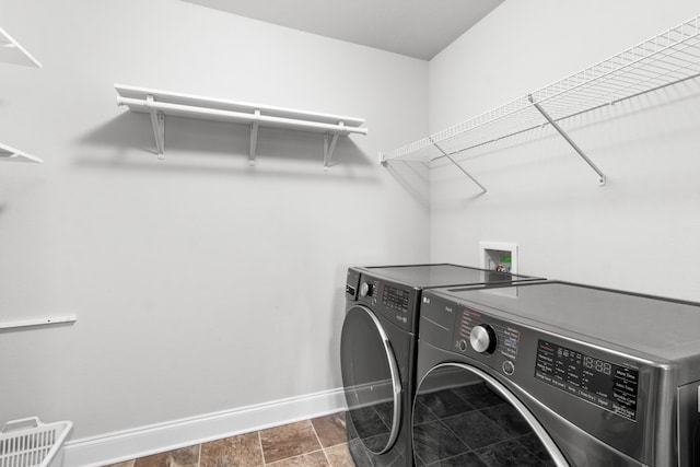 laundry room featuring separate washer and dryer