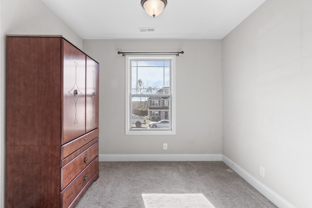 unfurnished bedroom with light colored carpet