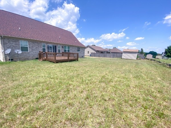 view of yard featuring a wooden deck