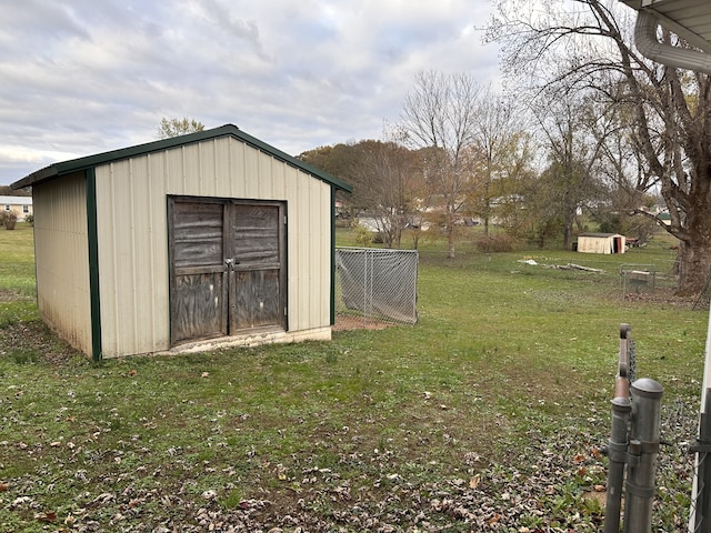 view of outdoor structure with a lawn