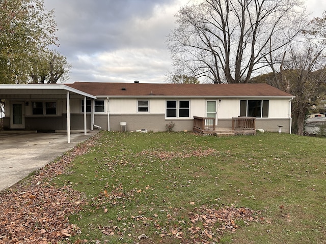 view of front of property with a carport, a deck, and a front lawn