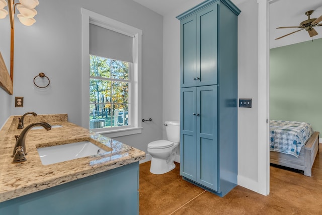 bathroom with vanity, toilet, ceiling fan, and tile patterned flooring