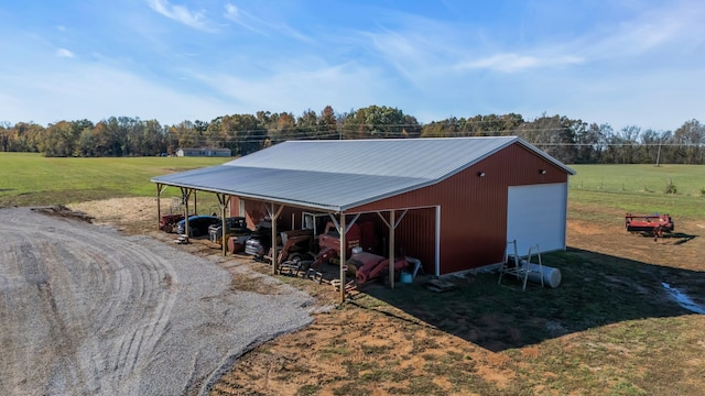 view of outdoor structure with a rural view