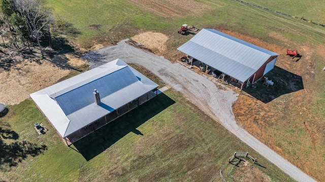 birds eye view of property featuring a rural view