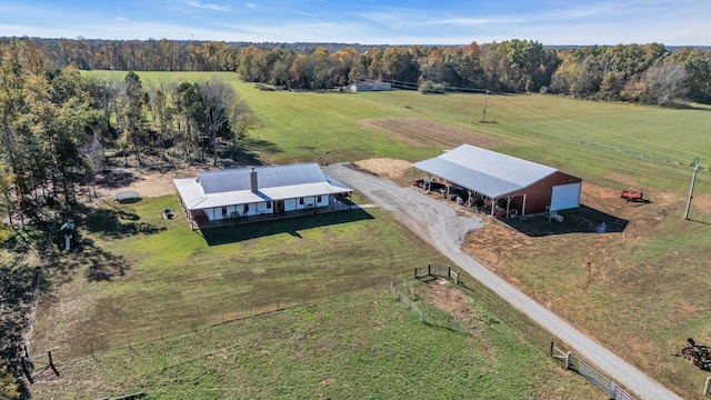 birds eye view of property with a rural view