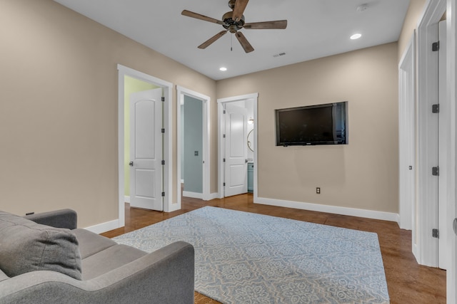 living room featuring ceiling fan and carpet floors