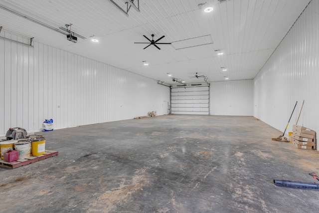 garage featuring a garage door opener and ceiling fan