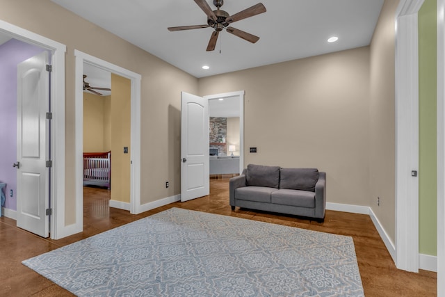 living area featuring ceiling fan