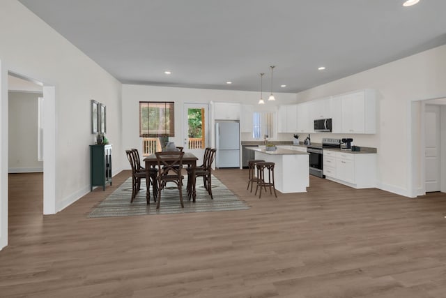 dining room with hardwood / wood-style floors