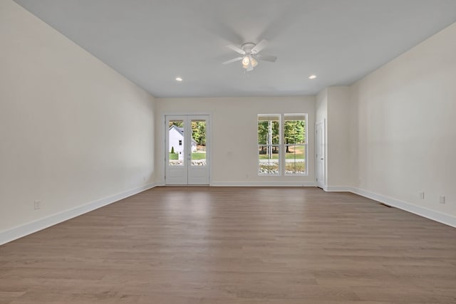 unfurnished room featuring ceiling fan and light hardwood / wood-style floors