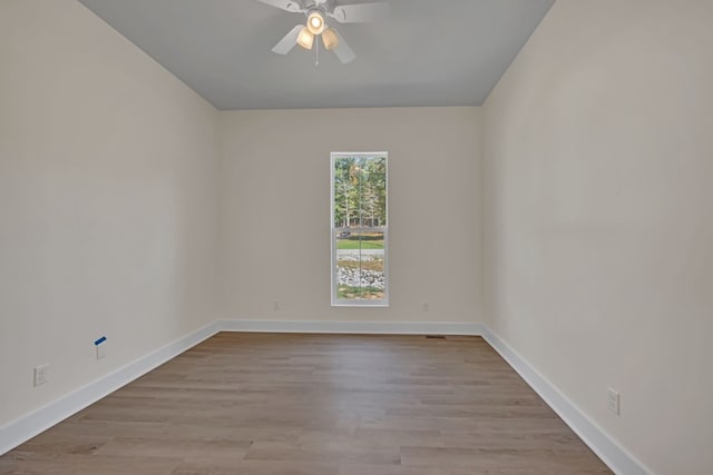 spare room with ceiling fan and light hardwood / wood-style flooring