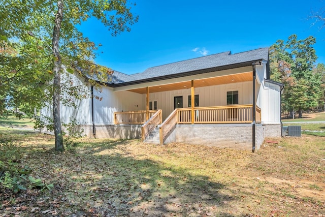 rear view of property with central air condition unit