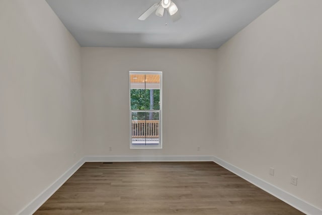 empty room with ceiling fan and light wood-type flooring