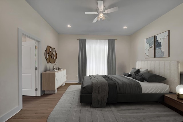 bedroom with hardwood / wood-style floors and ceiling fan