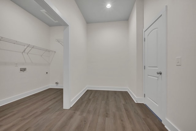 washroom with hookup for a washing machine, electric dryer hookup, and hardwood / wood-style floors