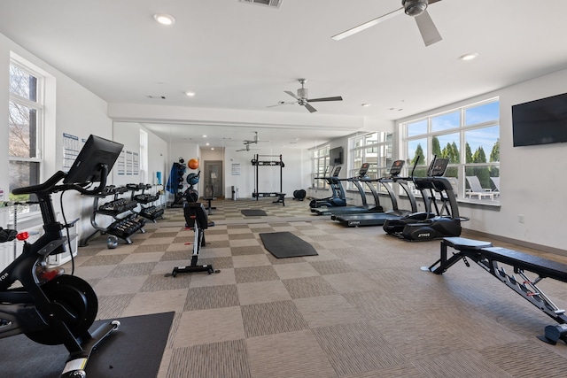 gym with light colored carpet and ceiling fan