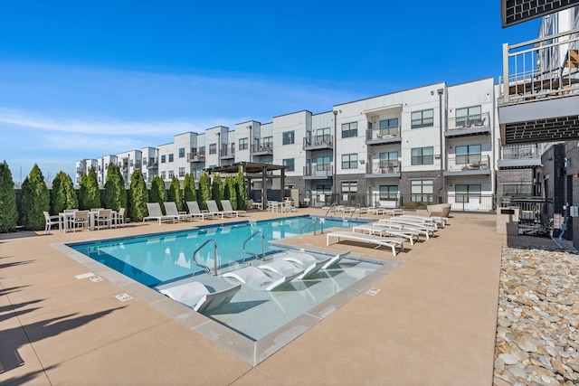 view of swimming pool with a patio area