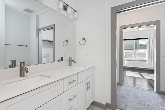 bathroom featuring vanity and wood-type flooring