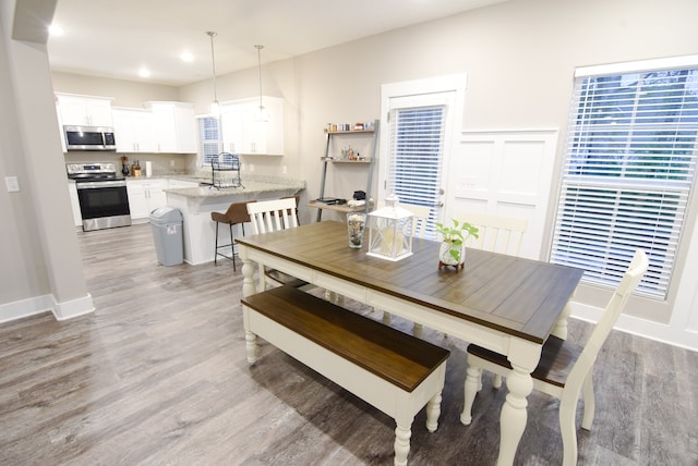 dining space featuring hardwood / wood-style flooring