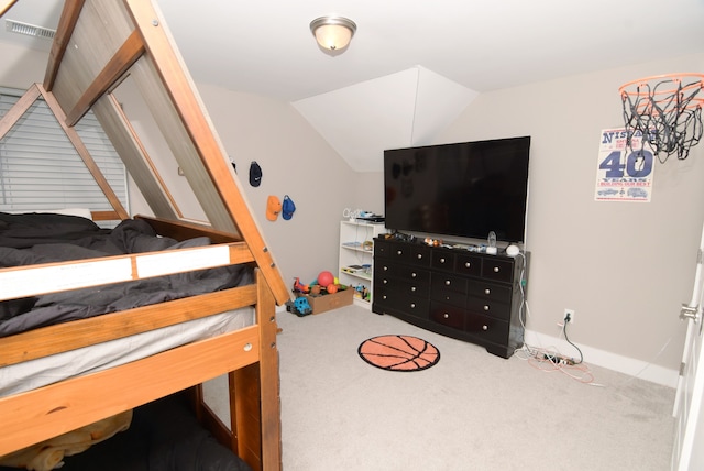 carpeted bedroom with vaulted ceiling