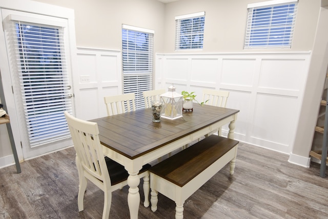 dining space with hardwood / wood-style floors