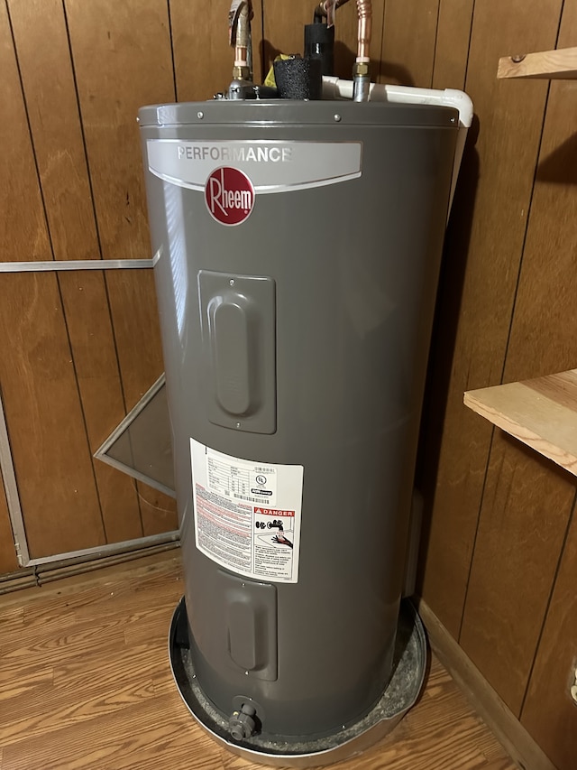 utility room with water heater