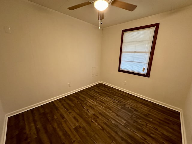 empty room featuring dark hardwood / wood-style floors and ceiling fan